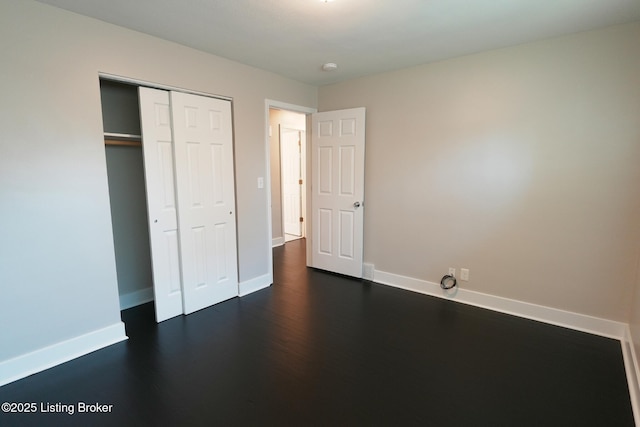 10104 Nanka Rd, Louisville, KY 40272 - unfurnished bedroom featuring dark wood finished floors and a closet