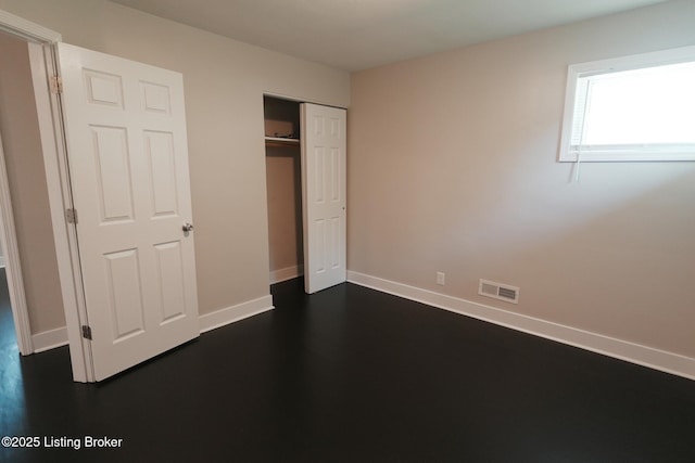 10104 Nanka Rd, Louisville, KY 40272 - unfurnished bedroom featuring a closet and dark wood-style floors