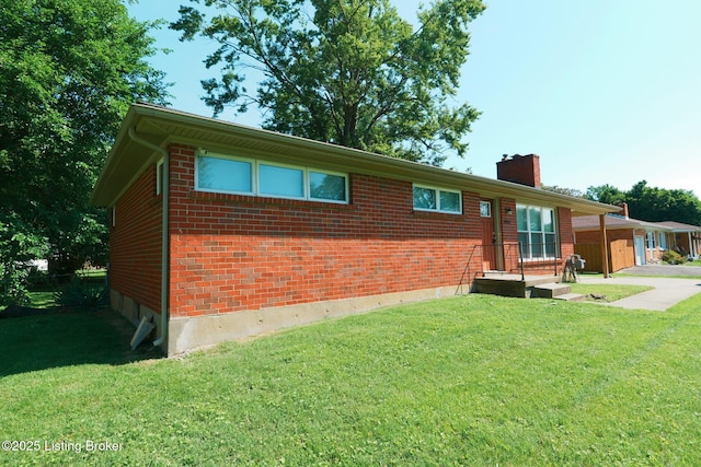 10104 Nanka Rd, Louisville, KY 40272 - view of front of home featuring a chimney, brick siding, and a front yard