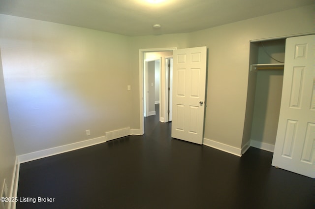 10104 Nanka Rd, Louisville, KY 40272 - unfurnished bedroom featuring a closet and dark wood-style floors