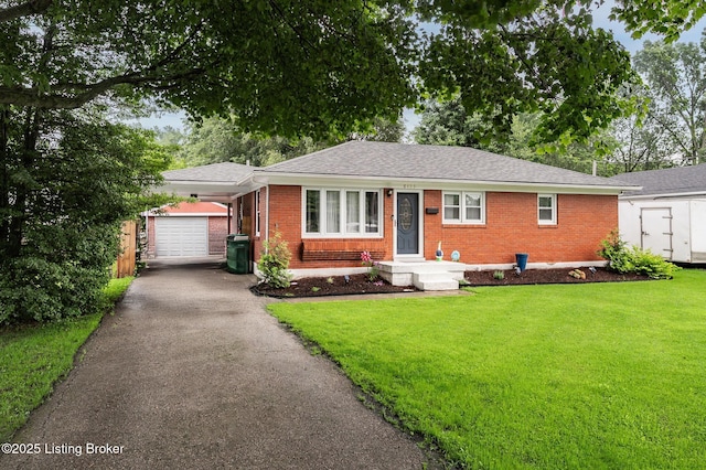 8433 Chase Rd, Louisville, KY 40258 - ranch-style home featuring an outdoor structure, brick siding, driveway, a front yard, and an attached garage