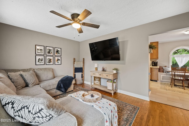 8433 Chase Rd, Louisville, KY 40258 - living room featuring a ceiling fan, wood finished floors, and a textured ceiling