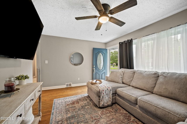 8433 Chase Rd, Louisville, KY 40258 - living room with light wood-style floors, ceiling fan, and a textured ceiling