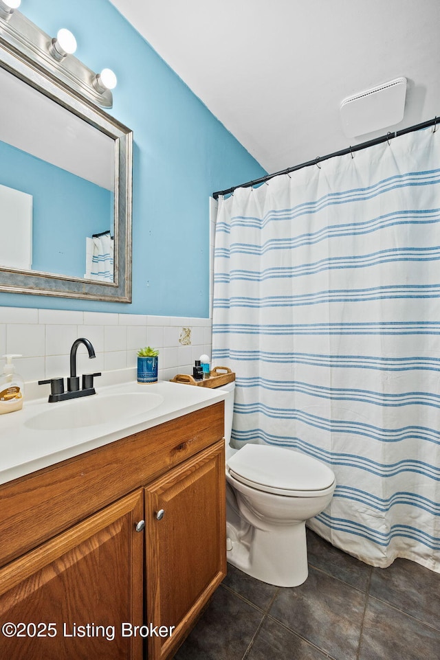 8433 Chase Rd, Louisville, KY 40258 - bathroom with vanity, tile patterned flooring, tile walls, and a wainscoted wall
