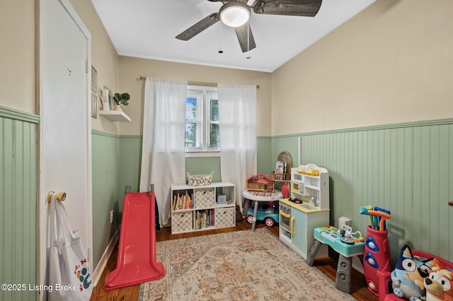 8433 Chase Rd, Louisville, KY 40258 - recreation room featuring a wainscoted wall, wood finished floors, and ceiling fan