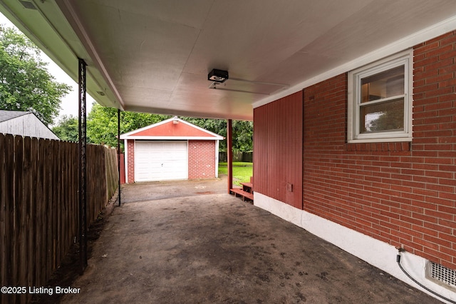 8433 Chase Rd, Louisville, KY 40258 - view of patio / terrace with an outdoor structure, concrete driveway, and a detached garage