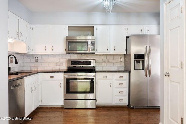 6503 Deep Creek Dr Unit 1, Prospect, KY 40059 - kitchen with appliances with stainless steel finishes, white cabinets, and backsplash