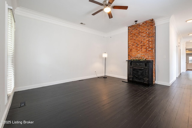 631 Lynn St, Louisville, KY 40217 - unfurnished living room with ceiling fan, dark wood finished floors, a fireplace, and crown molding