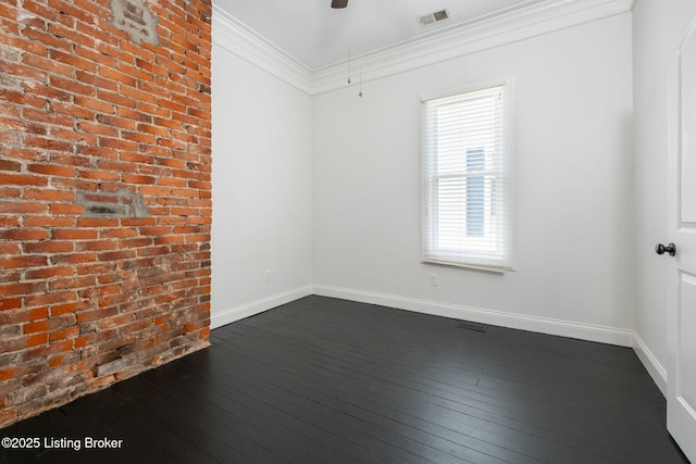 631 Lynn St, Louisville, KY 40217 - empty room with dark wood finished floors, brick wall, ceiling fan, and ornamental molding