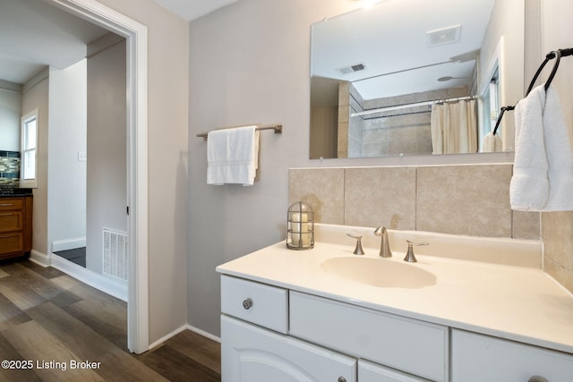 631 Lynn St, Louisville, KY 40217 - bathroom featuring vanity, wood finished floors, and a shower with curtain