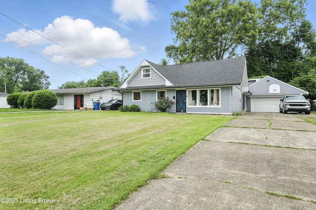9903 Ponder Ln, Louisville, KY 40272 - view of front of house with driveway, a front lawn, an attached garage, and an outdoor structure