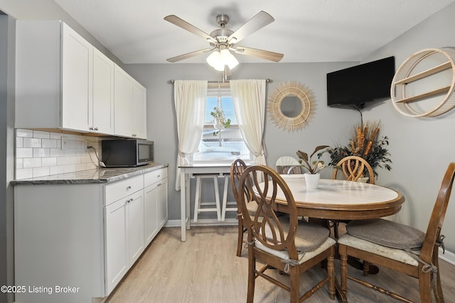 9903 Ponder Ln, Louisville, KY 40272 - dining area with light wood finished floors and a ceiling fan