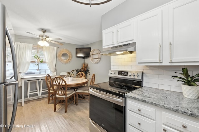 9903 Ponder Ln, Louisville, KY 40272 - kitchen with stainless steel appliances, under cabinet range hood, ceiling fan, decorative backsplash, and light wood finished floors