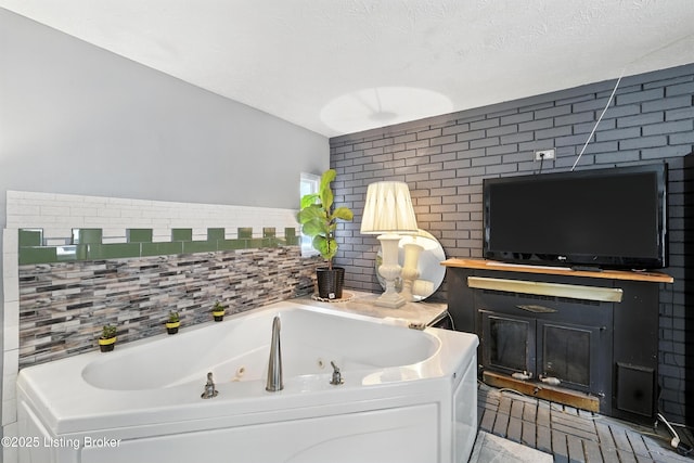 9903 Ponder Ln, Louisville, KY 40272 - full bathroom with a tub with jets, decorative backsplash, and a textured ceiling