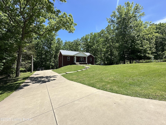 68 Lonnie Lawson Ct, Brandenburg, KY 40108 - view of grassy yard featuring concrete driveway