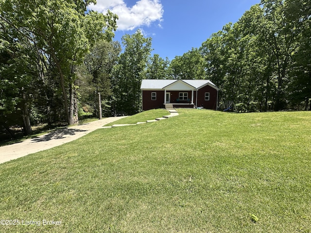 68 Lonnie Lawson Ct, Brandenburg, KY 40108 - view of front of home featuring a front yard, concrete driveway, and covered porch