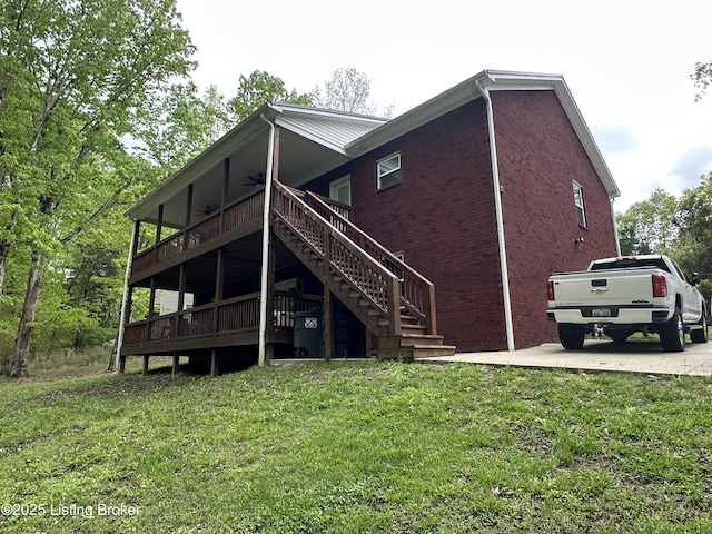 68 Lonnie Lawson Ct, Brandenburg, KY 40108 - rear view of property with a yard, stairs, ceiling fan, brick siding, and a deck