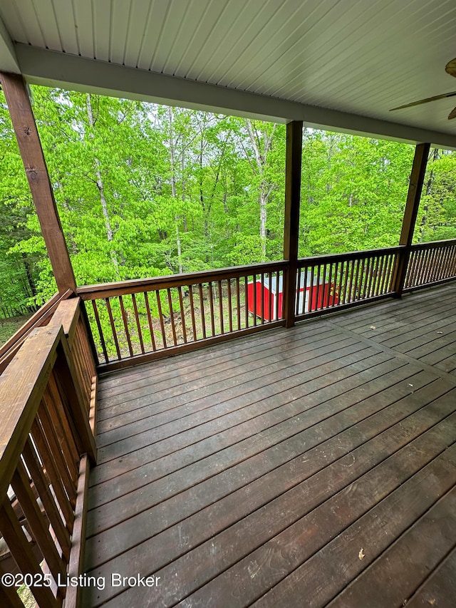 68 Lonnie Lawson Ct, Brandenburg, KY 40108 - wooden deck featuring ceiling fan and a view of trees