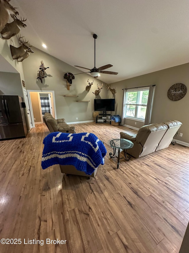 68 Lonnie Lawson Ct, Brandenburg, KY 40108 - living area with wood finished floors, lofted ceiling, and a ceiling fan