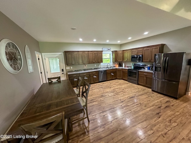 68 Lonnie Lawson Ct, Brandenburg, KY 40108 - kitchen with stainless steel appliances, hardwood / wood-style floors, light countertops, recessed lighting, and dark brown cabinetry