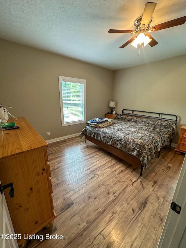 68 Lonnie Lawson Ct, Brandenburg, KY 40108 - bedroom with wood finished floors and a ceiling fan