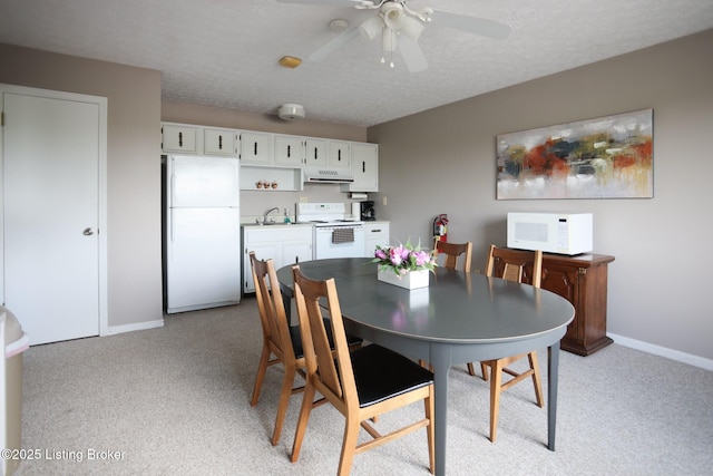 4180 Lyndon Way Unit 409, Louisville, KY 40207 - dining area with light carpet, a ceiling fan, and a textured ceiling