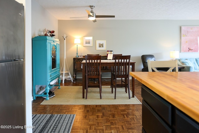 4180 Lyndon Way Unit 409, Louisville, KY 40207 - dining room featuring ceiling fan and a textured ceiling