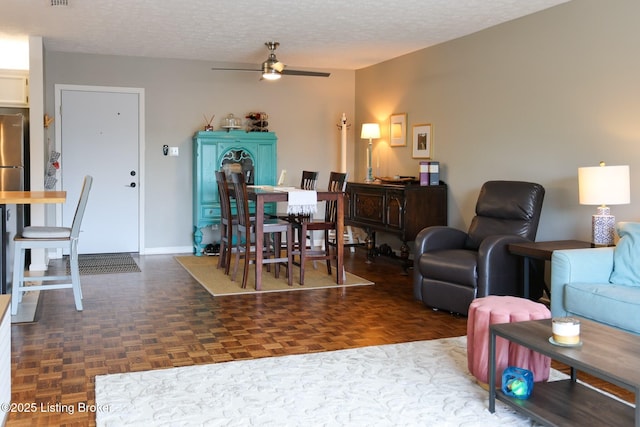 4180 Lyndon Way Unit 409, Louisville, KY 40207 - living area with ceiling fan and a textured ceiling