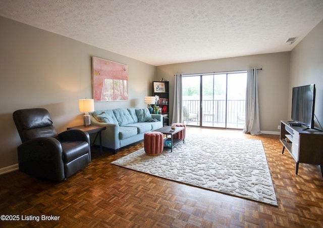 4180 Lyndon Way Unit 409, Louisville, KY 40207 - living area featuring a textured ceiling and baseboards