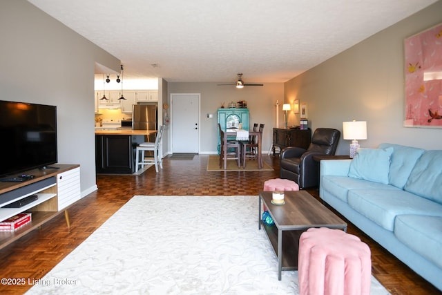 4180 Lyndon Way Unit 409, Louisville, KY 40207 - living room featuring ceiling fan and a textured ceiling