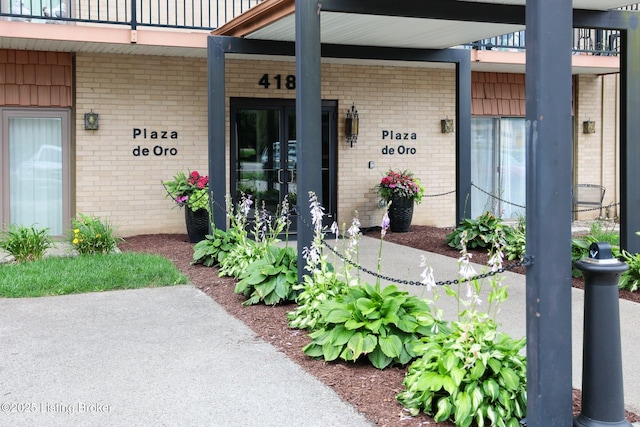 4180 Lyndon Way Unit 409, Louisville, KY 40207 - view of exterior entry with brick siding and a balcony