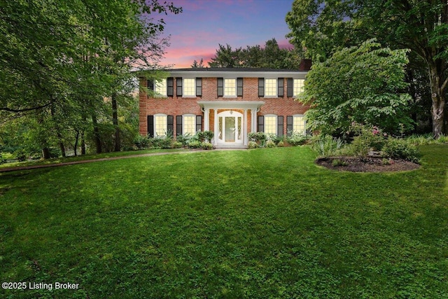 5612 Apache Rd, Louisville, KY 40207 - colonial inspired home featuring a front yard, brick siding, and a chimney