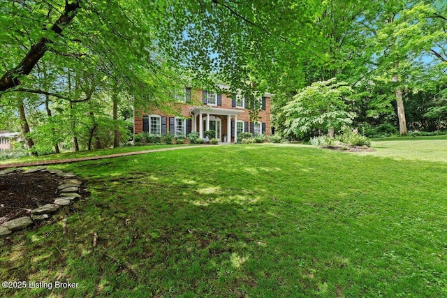 5612 Apache Rd, Louisville, KY 40207 - view of front facade featuring a front yard and brick siding