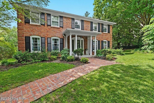 5612 Apache Rd, Louisville, KY 40207 - georgian-style home featuring a front lawn and brick siding