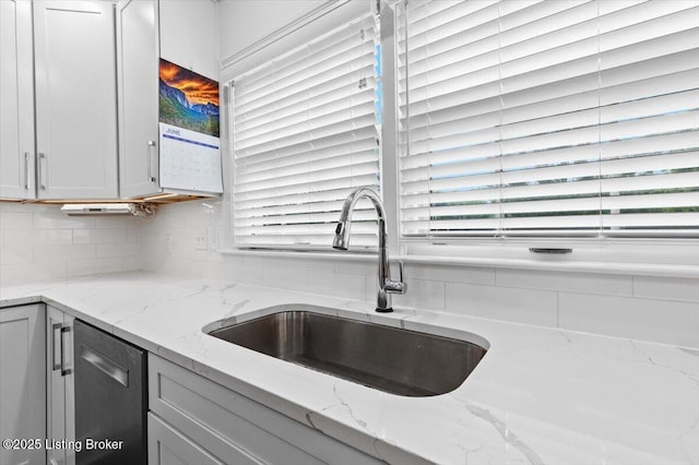 5612 Apache Rd, Louisville, KY 40207 - kitchen featuring dishwasher, decorative backsplash, and light stone countertops