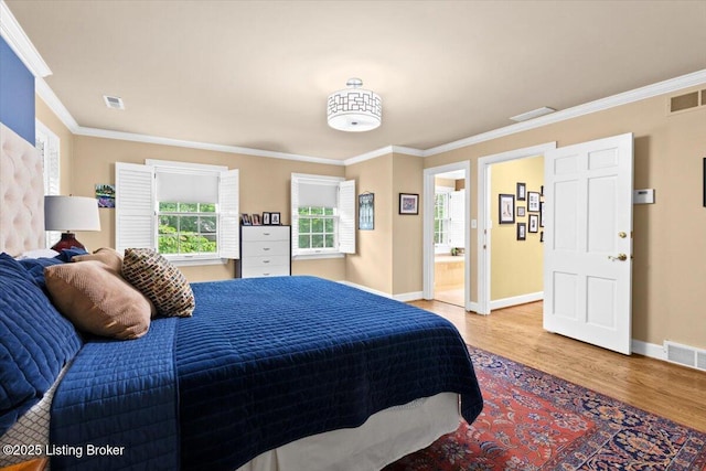 5612 Apache Rd, Louisville, KY 40207 - bedroom featuring light wood-style flooring, multiple windows, ornamental molding, and ensuite bath