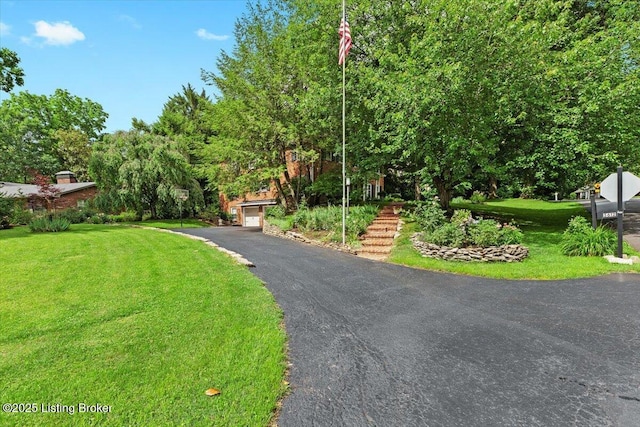 5612 Apache Rd, Louisville, KY 40207 - view of front of property with a front yard and a garage
