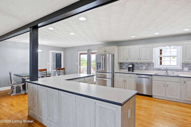192 Loretto Rd, Springfield, KY 40069 - kitchen featuring stainless steel appliances, a kitchen island, light wood-type flooring, white cabinetry, and recessed lighting