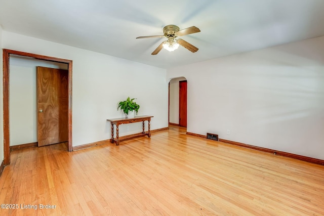 1721 S 4th St, Louisville, KY 40208 - empty room featuring arched walkways, light wood-type flooring, and ceiling fan