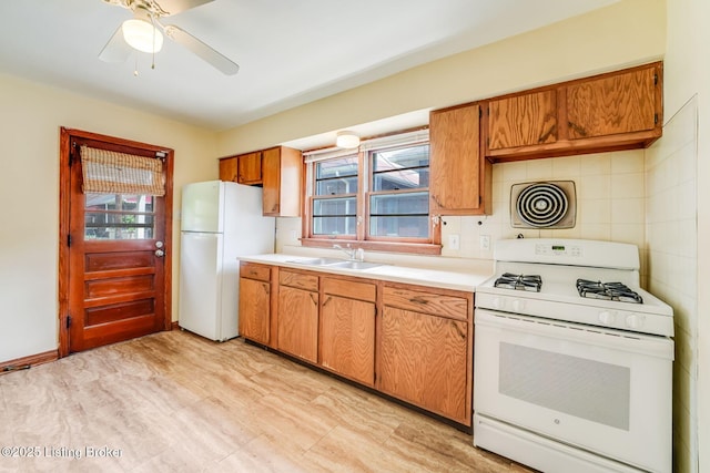 1721 S 4th St, Louisville, KY 40208 - kitchen with white appliances, healthy amount of natural light, light countertops, and brown cabinets