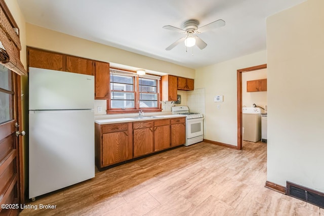 1721 S 4th St, Louisville, KY 40208 - kitchen with white appliances, light countertops, brown cabinetry, ceiling fan, and washer / clothes dryer