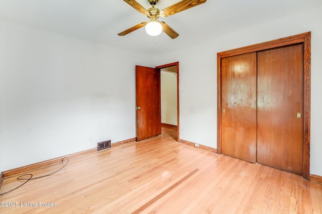 1721 S 4th St, Louisville, KY 40208 - unfurnished bedroom featuring light wood-type flooring, a closet, and ceiling fan