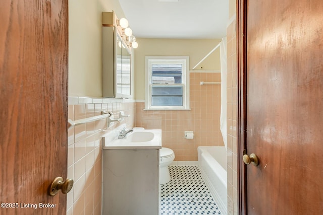 1721 S 4th St, Louisville, KY 40208 - full bathroom featuring tile walls, vanity, wainscoting, tile patterned floors, and shower / bath combination
