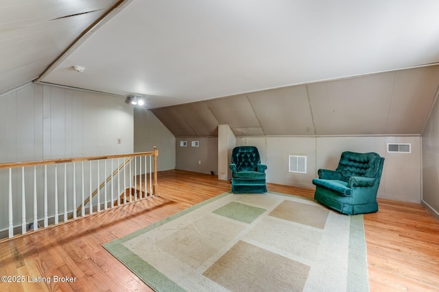 1721 S 4th St, Louisville, KY 40208 - unfurnished room with wood finished floors, lofted ceiling, and an upstairs landing