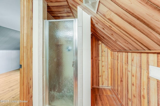 1721 S 4th St, Louisville, KY 40208 - bathroom featuring wood finished floors, a stall shower, wooden walls, and vaulted ceiling