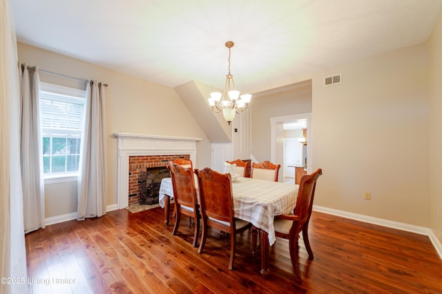 2990 Cedar Grove Rd, Shepherdsville, KY 40165 - dining area with a chandelier, wood-type flooring, and a brick fireplace