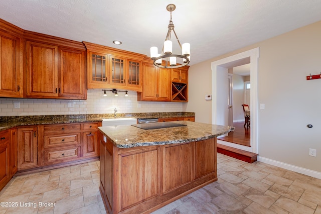 2990 Cedar Grove Rd, Shepherdsville, KY 40165 - kitchen with stone finish floors, tasteful backsplash, brown cabinets, a chandelier, and recessed lighting