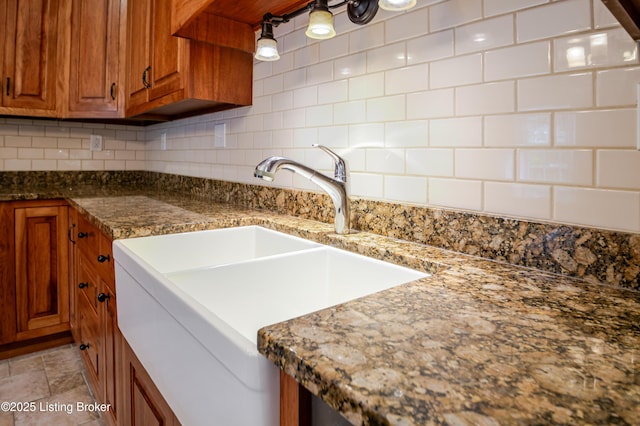 2990 Cedar Grove Rd, Shepherdsville, KY 40165 - kitchen with brown cabinets, backsplash, and dark stone countertops