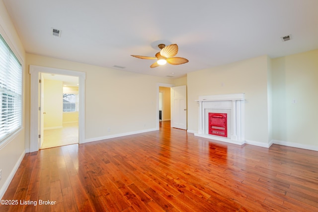 2990 Cedar Grove Rd, Shepherdsville, KY 40165 - unfurnished living room with hardwood / wood-style floors, a ceiling fan, and a fireplace
