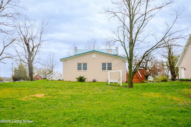 2990 Cedar Grove Rd, Shepherdsville, KY 40165 - view of side of property with a chimney, a yard, and concrete block siding